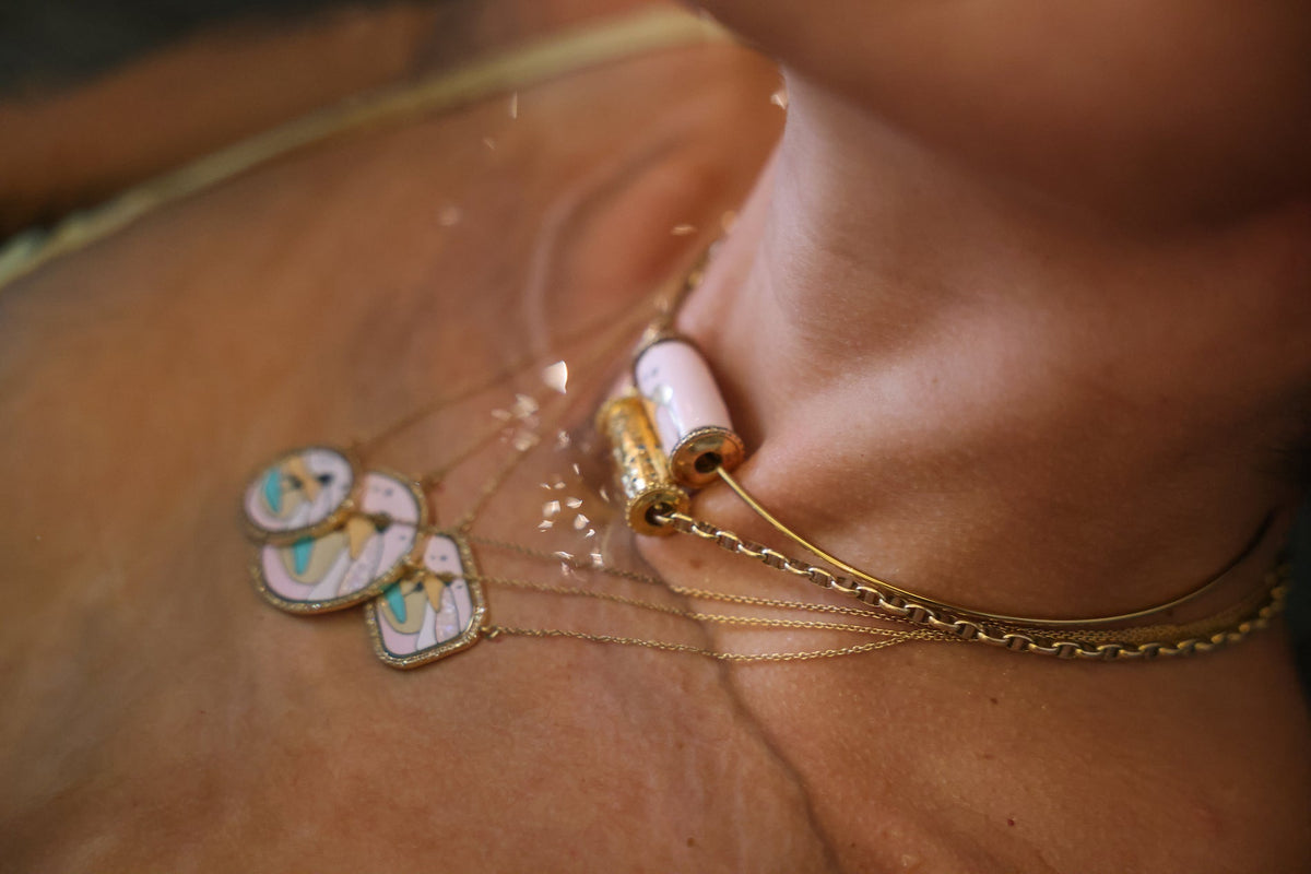 Desert Rose Magnetic worn at the neck — 18k gold pendant necklace with pink grand feu enamel and pavé diamonds, by Sandrine Barabinot