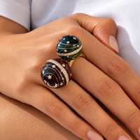 Double Bubble Circle ring worn on the hand, aubergine and green grand feu enamel on 18k gold — Sandrine Barabinot