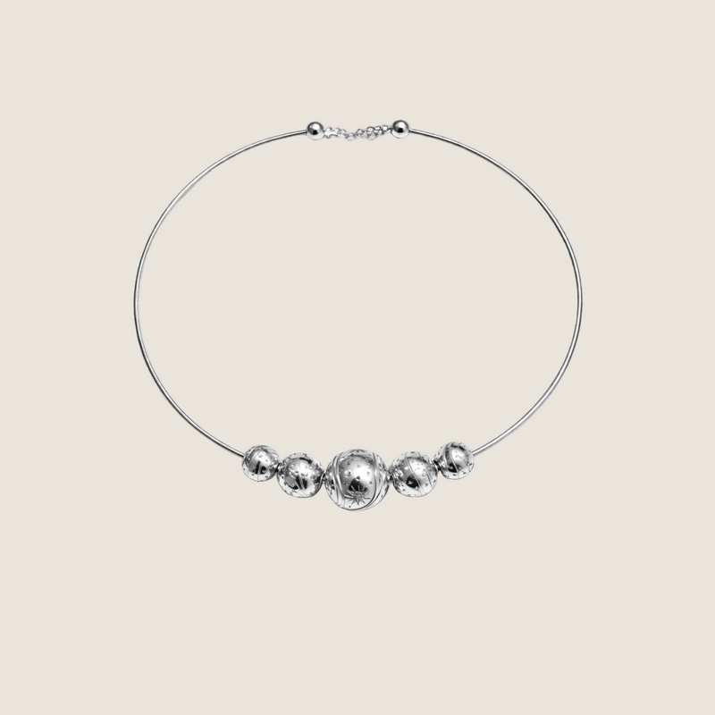 Kindred — Sandrine Barabinot rhodium-plated silver torque necklace with three graduated engraved Bubble spheres and white sapphires