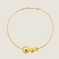 Torque Nomad necklace by Sandrine Barabinot — 18k yellow gold rigid torque with three Bubble spheres (16mm and 12mm brushed gold, 10mm mirror-polished gold), all set with diamonds. Kindred collection. Handcrafted in Geneva.